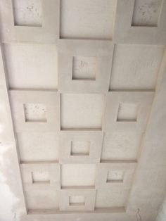 an unfinished ceiling with square and rectangle shapes