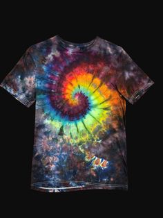 Size small ice dyed tshirt with inner rainbow and black scrunched background Summer Tie Dye T-shirt With Rainbow Print, Casual Multicolor Watercolor Print T-shirt, Tie Dye Grunge T-shirt For Spring, Spring Tie Dye Grunge T-shirt, Tie Dye Rainbow Print T-shirt For Summer, Summer Rainbow Print Tie Dye T-shirt, Bleached Multicolor Graphic Tee, Hand Dyed Rainbow Top For Summer, Hand Dyed Rainbow Tops For Spring