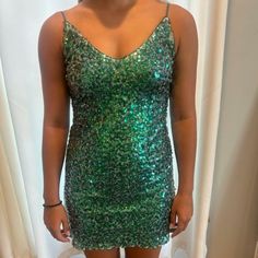 Homecoming Dress Never Worn, Green And Silver Sequins On White Netting. 2 Spaghetti Straps. No Zipper, Size Xs. I Have Other Dresses Listed So Take A Look. Smoke Free Home. Thank You. Green Spaghetti Strap Mini Dress For Homecoming, Green Sequin Dress For Homecoming, Glamorous Green Mini Dress With Spaghetti Straps, Green Sequined Mini Dress With Spaghetti Straps, Green Sequined Spaghetti Strap Mini Dress, Dresses Homecoming, Lulus Dresses, Green And Silver, Lulu Dresses