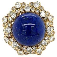 Simply Beautiful! Elegant and finely detailed Lapis Lazuli and Diamond Vintage Cluster Ring. Centering a Securely Hand set Cabochon Blue Lapis Lazuli, surrounded by Diamonds weighing approx. 3.00 total Carat weight. Hand crafted in 18 Karat yellow Gold. Ring size 7.25, we offer ring re-sizing. In excellent condition, recently professionally cleaned and polished. More Beautiful in real time! Sure to be admired…Timeless and outstanding in every way! Vintage Cluster Ring, Blue Lapis Lazuli, Gold Cocktail Ring, Gold Cocktail, Blue Lapis, Diamond Gold, Heel Boots, Vintage Diamond, Cluster Ring