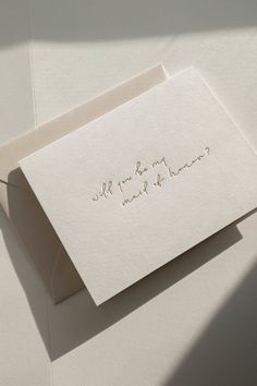 a white card with the words we are married on it and an envelope that says,