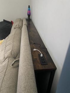 a couch with an electronic device on it