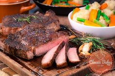 some meat and vegetables on a cutting board