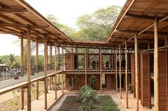 the inside of a building that is made out of wood and has several windows on each side