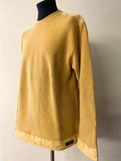 Introducing a classic piece of men's fashion from the 90s - this Vintage Sweater by Amerigo Vespucci is a true gem! Made from 100% wool in a mustard yellow hue, this sweater exudes a warm and cozy vibe, making it a must-have addition to any vintage-loving gentleman's wardrobe.  Revive your wardrobe with this unique, vintage treasure that effortlessly combines comfort and style. Men's Vintage 90's pullover. Ribbed crew neckline, cotton shoulder in set with the same cotton repeated on the sleeve c Retro Cotton Tops For Layering, Vintage Cotton Sweater For Layering, Mustard Cotton Long Sleeve Sweater, Mustard Cotton Tops For Winter, Mustard Fitted Crew Neck Sweater, Mustard Cotton Sweatshirt For Fall, Vintage Mustard Tops For Fall, Fashion From The 90s, Amerigo Vespucci