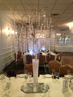 an elegant centerpiece in the middle of a dining room