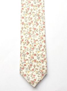 DESCRIPTION: This lovely men's skinny tie has been handmade using a beautiful vintage first floral cotton.FABRIC: Cotton.LINING FABRIC: Cotton.--------------------------------------------------------------------------------------------DETAILS:• Made the traditional way with fabric cut on the bias• Each tie has canvas lining throughout• Fabric lining just at the tip on each end of the tie• Width at the widest part measures approx 2.5 inches• The length of each tie is approx 58 Inches• Comes packa Classic White Ties For Spring, Classic White Spring Ties, White Floral Print Ties For Summer, Dapper White Suit And Tie Accessories For Summer, Summer Floral Print White Ties, Summer White Floral Print Ties, Classic Floral Print Ties For Summer, Classic Floral Print Ties, Classic Floral Suit And Tie Accessories For Spring