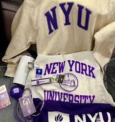 the new york university sweatshirt and other items are on display