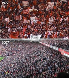 there are many people in the stadium holding flags