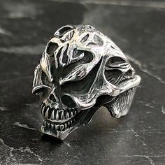 Men Skull Gothic Engraved Silver Ring , Motorcycle Punk Hippie Ring , Skull Metalsmith Hipster Ring, Cool Ring , Gothic Ring Jewelry for Men , Gift For Him , Same Day For Shipping ✧ Product Details * Handmade İtem * Gender : Male / Female * Material : 925K Sterling Silver * Ring Weight : 13.5 Grams ✔ Usage Details * Silver jewelry is very sensitive to chemicals. It is recommended to keep away from chemical substances such as cream, bleach, deodorant, detergent. * Silver jewelry can also darken quickly in salt water, that is, in sea water. For this reason, it is best to remove them when swimming in the sea. ✔ Shipping * Your orders placed on weekdays are delivered to the cargo on the same day. Your orders placed on the weekend are delivered to the cargo on Monday. ✔ Other Details * Our prod Black Symbolic Skull Ring For Halloween, Symbolic Black Skull Ring For Halloween, Silver Skull Ring For Halloween Streetwear, Unique Black Skull Ring For Halloween, Silver Grunge Rings For Halloween, Punk Skull Ring For Halloween Streetwear, Punk Style Skull Ring For Halloween Collectible, Gothic Skull Ring For Streetwear, Black Ring For Halloween Streetwear