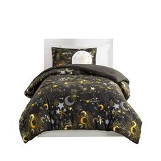 a black and gold comforter set with stars and moon designs