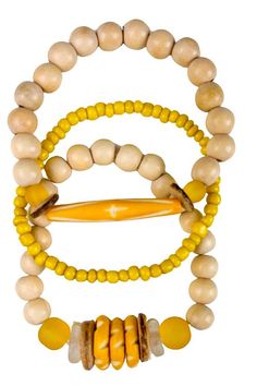 The Twine & Twig Trio Stack is designed using globally sourced beads. They can be worn individually or stacked up. Fits wrist size 7". Yellow Stackable Beaded Bracelets, Adjustable Yellow Bracelet With Wooden Beads, Adjustable Yellow Wooden Beaded Bracelets, Yellow Bracelet With Round Wooden Beads, Yellow Wooden Bead Bracelets, Yellow Wooden Beads Bracelet, Twine And Twig, Stack Bracelet, Bracelet Stack