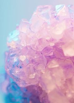 a close up view of some pink and blue crystals