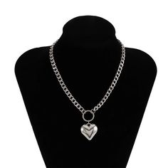 Unleash Your Edgy Side with a Touch of Elegance Step into the world of bold fashion with our Heart Pendant Punk Choker, a perfect blend of edgy punk style and feminine charm. This short-style necklace, designed for the modern woman, features a striking heart pendant hanging from a sturdy metal link chain. Its iron alloy construction ensures durability while offering a gleaming finish that captures the eye. Ideal for parties, casual outings, or adding a daring twist to your daily wear, this choke Trendy Metal Heart Charm Necklace, Trendy Party Heart Choker Necklace, Emo Metal Chain Necklaces, Edgy Heart-shaped Chain Jewelry, Emo Metal Chain Necklace, Emo Style Metal Chain Necklace, Emo Metal Necklace For Party, Emo Metal Necklace For Concerts, Emo Style Metal Necklace For Party