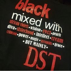 the back of a black t - shirt with red lettering that reads, black mixed with