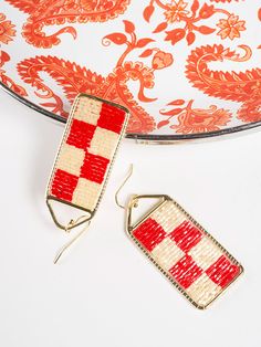 Checker earrings are the ultimate statement jewelry, and the red and white color combo kicks it up a notch. These bold, beaded earrings are just the thing to brighten your day! Brass and seed beads 2" length Made fair trade in India by one of our longstanding production partners Red Woven Jewelry For Summer, Woven Red Jewelry For Summer, Red Handwoven Beach Jewelry, Adjustable Red Handwoven Earrings, Red Bohemian Rectangular Earrings, Bohemian Red Rectangular Earrings, Red Beaded Earrings As Summer Gifts, Red Earrings With Colorful Beads For Summer, Summer Red Earrings With Colorful Beads