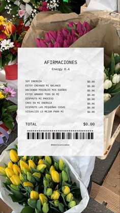 flowers for sale at an outdoor market with a price tag on the front and side