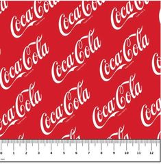 a ruler with coca - cola on it and the word's name in white