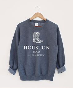 Houston Sweatshirt, Texas Sweater, USA State Hoodie, Houston Texans ♥ PRODUCTION TIME: 1-5 days (Usually 1-2 days) ♥ SHIPPING TIME: 2-5 days (Usually 3 days) ♥ PRODUCT DESCRIPTION: Ideal for any situation, a unisex heavy blend crewneck sweatshirt is pure comfort. These garments are made from polyester and cotton. This combination helps designs come out looking fresh and beautiful. The collar is ribbed knit, so it retains its shape even after washing. There are no itchy side seams on these sweate Relaxed Fit Fan Apparel Sweatshirt For Winter, Fitted Crew Neck Graphic Print Hoodie, Fitted Graphic Print Hoodie With Crew Neck, Winter Crew Hoodie Pre-shrunk, Relaxed Fit Hoodie For College, Pre-shrunk Crew Hoodie For Winter, Unisex Long Sleeve Sweatshirt For Fall, Casual Fitted Letter Print Sweatshirt, Fitted Letter Print Hoodie Sweatshirt