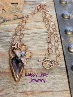 "Beautiful Amethyst Gemstone Copper Necklace.  Wonderful Large Amethyst Gemstone.  This is definitely a Statement Necklace. *  Handmade Artisan Electroformed Amethyst Gemstone Pendant *  Floral Electroformed Copper Flower *  18' Copper Plated Chain *  Copper Jump Rings *  Copper Toggle Another \"One of a Kind\" Artisan Jewelry Creation by Klassy Joolz - SRAJD #3714 Thank you for visiting my Shop in Lake Havasu City, AZ!   To see more of my Artisan Designs please go to:  www/klassyjoolz.etsy.com. Lake Havasu City, Lake Havasu, Copper Necklace, Copper Pendants, Copper Plated, Amethyst Gemstone, Jewelry Creation, Handmade Artisan, Artisan Jewelry