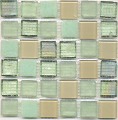 green and beige glass mosaic tile on a white wall