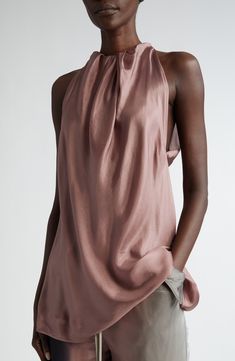 Ethereal satin silk lends beautiful drape to a sleeveless top with a gathered neckline, showing a softer side to the designer known for his bold creations. 32" length (size 44 EU) Jewel neck Sleeveless, with cutaway shoulders 100% silk Dry clean or hand wash, line dry Made in Italy Designer Clothing Chic Sleeveless Top With Satin Finish, Chic Draped Satin Top, Silk Draped Evening Tops, Sleeveless Satin Finish Top For Evening, Sleeveless Satin Tops For Evening, Sleeveless Silk Top With Satin Finish, Elegant Silk Halter Neck Blouse, Elegant Draped Silk Top, Sleeveless Silk Blouse For Night Out