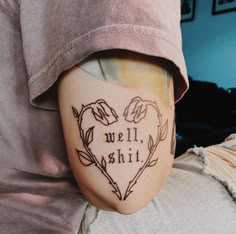 a person with a tattoo on their leg that says, we'll shii