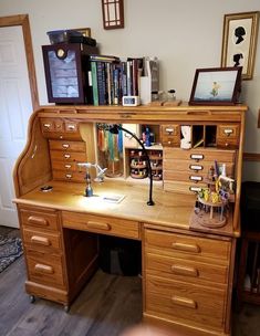 a wooden desk topped with lots of drawers