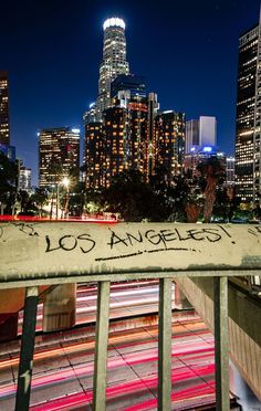 the city skyline is lit up at night