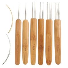 six bamboo toothbrushes are lined up next to each other with metal tips in them