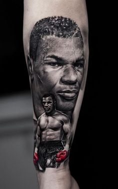 a man's arm with a tattoo on it and a portrait of the boxer