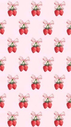 a pattern with strawberries and bows on a light pink background that looks like fabric