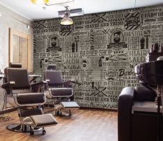 a salon with chairs and hair dryers on the floor in front of a wall