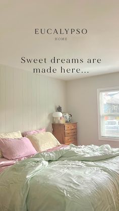 there is a bed with pink and green sheets in the room that says, eucalyptus pso home sweet dreams are made here