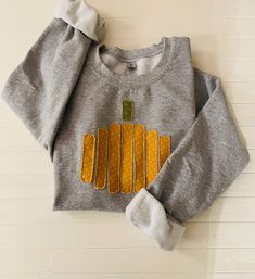 Get your FALL on with this quirky handmade sweatshirt. Pumpkin appliqué  is fused and then sewn on soft, oversized sweatshirt. The ridges of the pumpkin stylishly fray more with each wash, giving it a worn, vintage vibe. Looks great with faded jeans. The simple linear design will be a fun addition to your seasonal sweatshirt collection. Sweatshirt arrives new and unlaundered. Distressed Long Sleeve Sweatshirt For Fall, Fall Long Sleeve Distressed Sweatshirt, Oversized Distressed Sweatshirt For Fall, Distressed Sweatshirt For Fall With Relaxed Fit, Distressed Relaxed Fit Sweatshirt For Fall, Fall French Terry Sweater, Fall Cotton Orange Sweater, Orange Cotton Sweatshirt For Fall, Homemade Sweatshirt Ideas