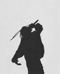 the silhouette of a man holding a baseball bat in his right hand and looking up