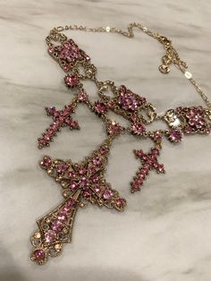 24k gold plated triple cross choker with light rose colored  crystals. It is hypoallergenic and has an adjustable chain. Great piece to wear out and get noticed! FREE gift with each item purchased. Nails Moodboard, Cross Choker, Expensive Jewelry Luxury, Indie Jewelry, Body Jewelry Piercing, Light Rose