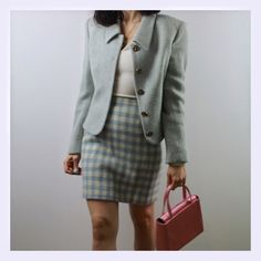 Vintage 90s Istante by Gianni Versace wool skirt suit. Really a icon of fashion history. Light blue mélange jacket with beautiful metal buttons and hight waist gingham mini skirt. Size 6 uk. 100% pure wool, fully lined. Made In Italy. Excellent vintage conditions. Shipping of this items takes one week for dry cleaning. I wish the dress is perfect for you! All items are vintage and used. However they are all in good to excellent condition. Any defect is specified. Sometimes, small signs of use ar Classic Winter Skirt Suit With Button Closure, Winter Classic Skirt Suit With Button Closure, Classic Winter Skirt Suit With Buttons, Classic Spring Skirt Suit With Buttons, Retro Skirt Suit For Office, Winter Office Skirt Suit With Button Closure, Gingham Mini Skirt, A Icon, Versace Vintage