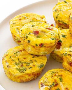 several small muffins on a white plate