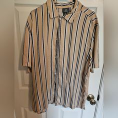 Tan With Stripes. Large Hm Button Down Short Sleeve Shirt. Large. Never Worn. Excellent Condition Casual Beige Button-up Camp Shirt, Casual Beige Button-up Short Sleeve Shirt, H&m Relaxed Fit Shirt With Buttons, H&m Relaxed Fit Shirt With Button Closure, H&m Collared Shirt With Button Closure, H&m Tops With Buttons And Relaxed Fit, H&m Relaxed Fit Collared Shirt, H&m Collared Shirt For Spring, H&m Button-up Shirt For Summer