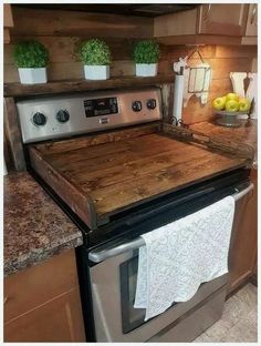 a stove top oven sitting inside of a kitchen next to a counter with two lemons on it