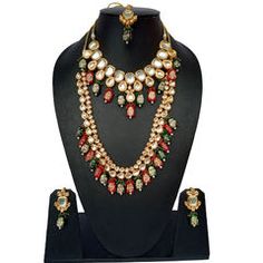 Gold Rodium Polish Green, Red and Maroon color Necklace in Metal Alloy studded with Kundan Festive Red Metal Jewelry, Red Jeweled Kundan Necklace For Celebrations, Festive Red Jeweled Jewelry, Red Jeweled Kundan Necklace For Festivals, Red Kundan Jewelry For Party, Red Jeweled Kundan Jewelry, Red Kundan Necklaces With Meenakari, Red Meenakari Necklace For Festive Occasions, Red Kundan Necklace With Meenakari Detail