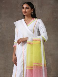 A three piece soft cotton kurta set in white comes with an attached mulmul lining. It has colour block laces with organza insert on the neck,sleeves and pants. It is paired with a white soft cotton straight pant with an attached mulmul lining with organza insert and colour block laces. Color: White Fabric Composition: Kurta Set - Soft cotton Dupatta - Organza Note: The product will be delivered within 20-25 days of order placed Care Instruction: Dry Clean Only. Do not use heavy Iron White Palazzo Set With Embroidered Border And Straight Kurta, White Cotton Silk Festive Sets, Festive White Cotton Silk Churidar, Festive White Cotton Silk Set, Off White Cotton Anarkali Set With Embroidered Border, White Kurta With Sheer Dupatta In Mulmul, White Mulmul Kurta With Sheer Dupatta, White Embroidered Palazzo Set For Diwali, White Mulmul Palazzo Set