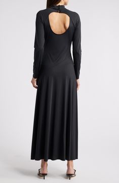 Asymmetric seams lend modern style to this versatile maxi dress boasting sumptuous stretch for event-ready comfort. 54 1/2" length (size Medium) Back keyhole with button-and-loop closure Mock neck Long sleeves Unlined 87% nylon, 13% spandex Dry clean Imported Sleek Maxi Dress With Back Opening, Elegant Evening Dress With 4-way Stretch, Sleek Stretch Maxi Dress With Side Slits, Formal Stretch Maxi Dress With Bias Cut, Sleek Stretch Maxi Dress With Flattering Silhouette, Sleek Stretch Maxi Dress For Formal Occasions, Elegant Formal Dress With 4-way Stretch, Flattering Elastane Maxi Dress, Elegant Stretch Maxi Dress With Bias Cut