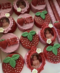 strawberry shaped cookies decorated with photos and strawberries