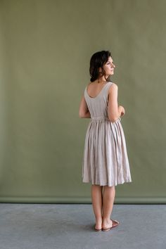 Linen Midi Dress For Garden Party, Knee-length Linen Midi Dress For Garden Party, Knee-length Linen Dress For Summer Garden Party, Sleeveless Fitted Linen Dress For Garden Party, Summer Sleeveless Dress In Beige For Daywear, Fitted Sleeveless Linen Dress For Garden Party, Beige Sleeveless Summer Dress For Daywear, Elegant Flax-colored Spring Dresses, Elegant Flax Color Dress For Spring