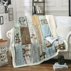 a living room with a couch, chair and bookshelf covered in a blanket