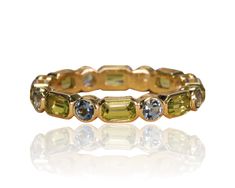 DESCRIPTION *Band Width : 4.08 mm *Emerald Cut Natural Color Stone Eternity Band *Channel Set , Thick Gold Band *Metal Options: 14k White Gold/ 14k Yellow Gold/ 14k Rose Gold *Accent Stone 1: Peridot *Size of stone: 5x3mm/Emerald Cut *Carat Weight: 2.45ct *Color: Vibrant Yellowish Green *Clarity: Type II - Very Slightly Included/VSI *Cut: Precision Cut *Accent Stone 2: Aquamarine *Size of stone: 3.2mm *Carat Weight: 0.84ct *Color: Soothing Light Blue *Clarity: Type I - Eye Clean *Cut: Precision Thick Gold Band, Yellowish Green, Band Metal, Rose Gold Accents, Pink Tourmaline Ring, Channel Setting, Half Eternity Band, Black Onyx Ring, Peridot Ring