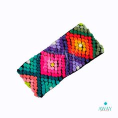 the colorful beaded case is made from plastic beads and has an interesting pattern on it