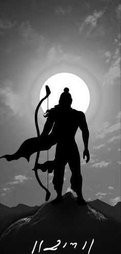 the silhouette of a man holding an arrow on top of a hill